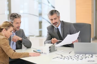 Estate planning attorney reviewing document with client