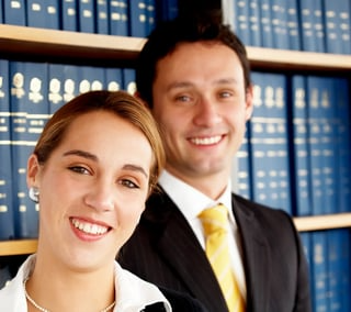 business_20woman_20with_20her_20partner_20in_20an_20office_20smiling