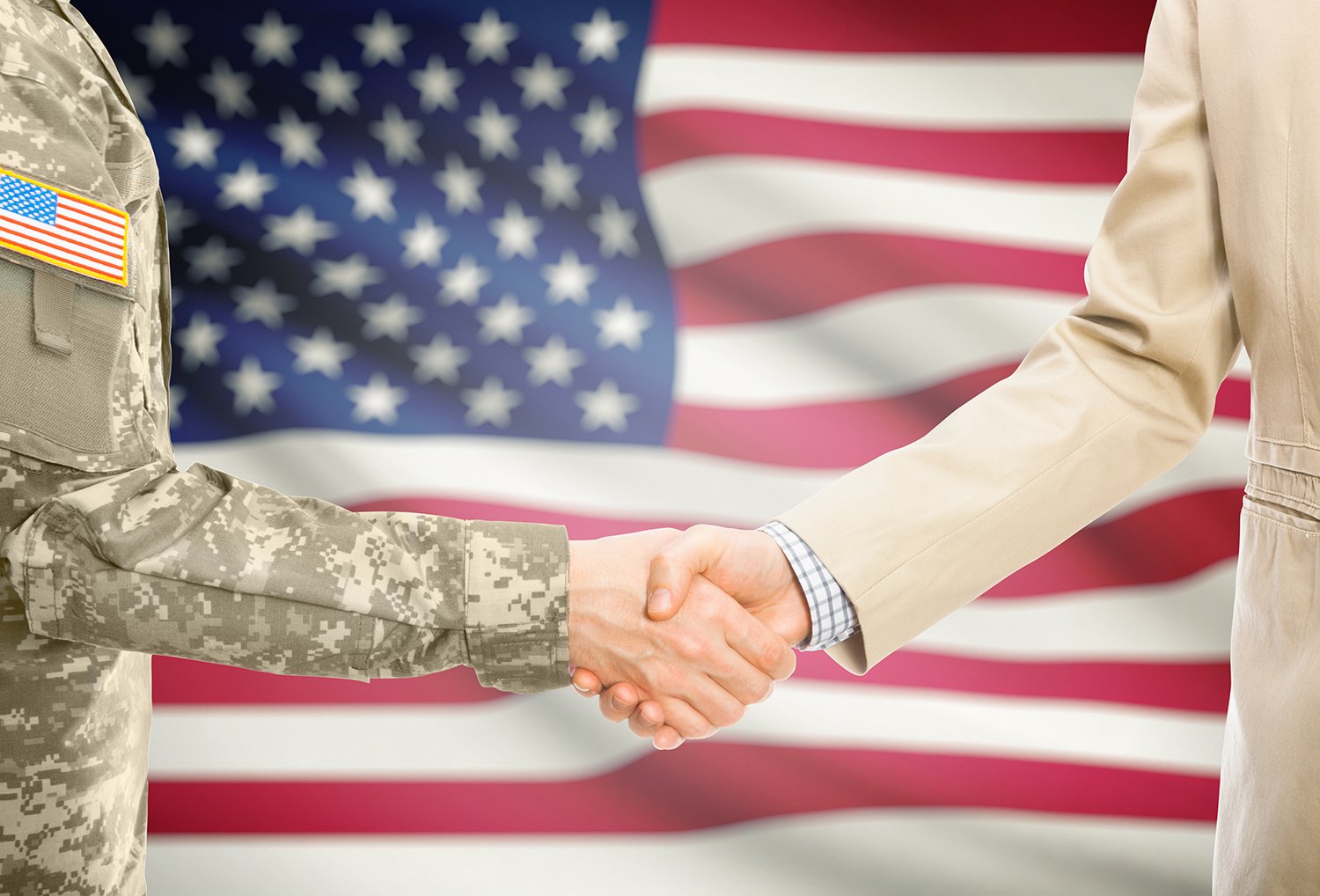 veteran shaking hands with businessman